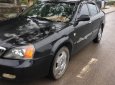 Cần bán gấp Daewoo Magnus đời 2004, màu đen giá cạnh tranh