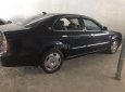 Cần bán gấp Daewoo Magnus đời 2004, màu đen, 132tr