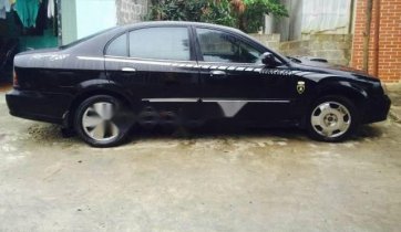 Cần bán xe Daewoo Magnus năm 2004, màu đen số tự động