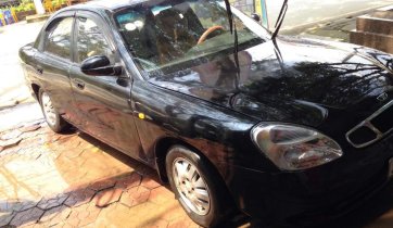 Cần bán ô tô Daewoo Nubira sản xuất 2002, màu đen nhập khẩu