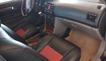 Chính chủ bán Daewoo Magnus 2.0 MT 2004, màu đen