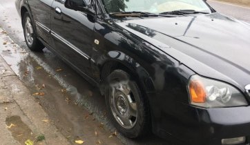 Cần bán gấp Daewoo Magnus đời 2004, màu đen giá cạnh tranh